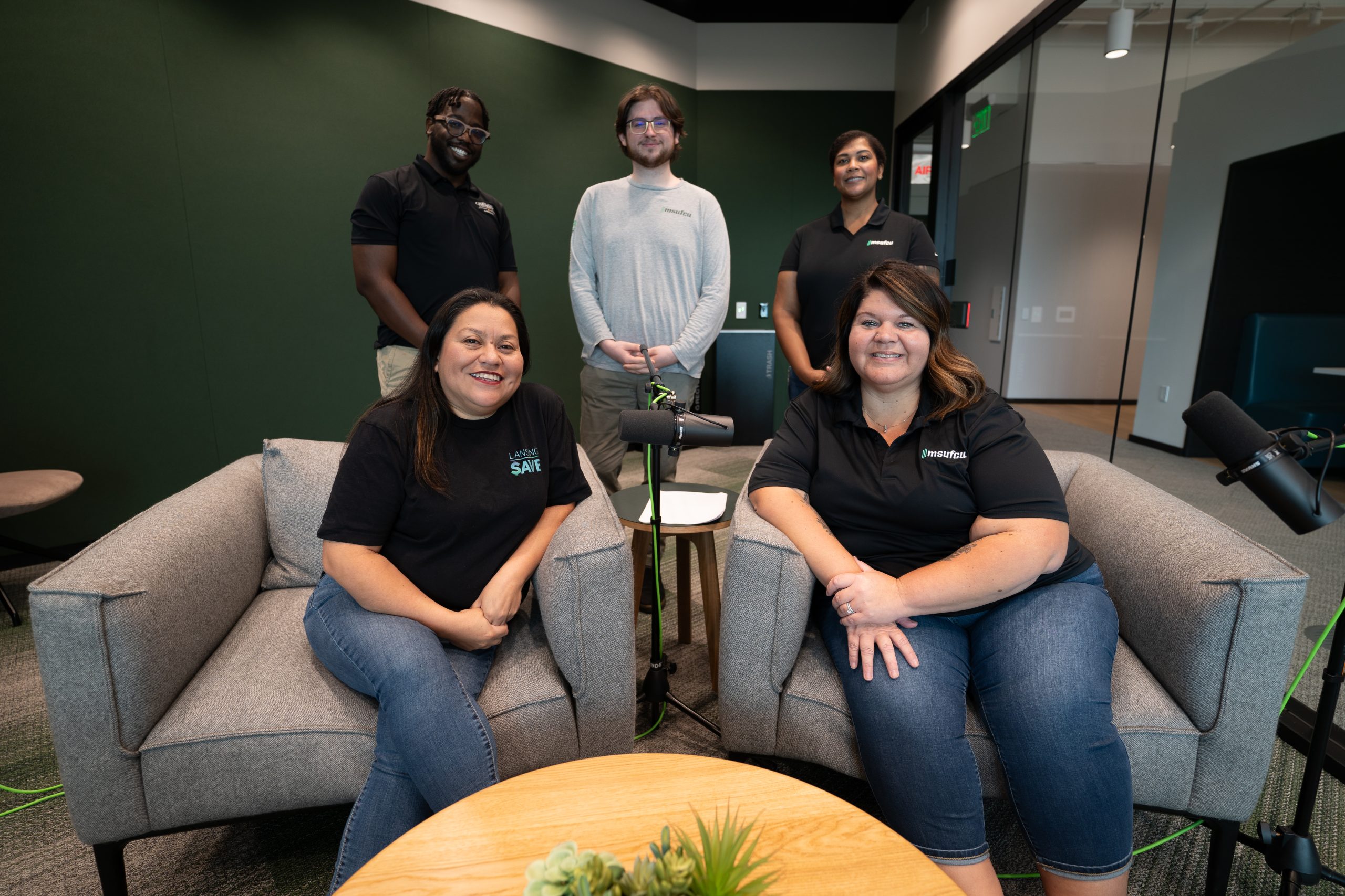 Five members of the Financial Education department pose in the Wallet Watch podcast studio.