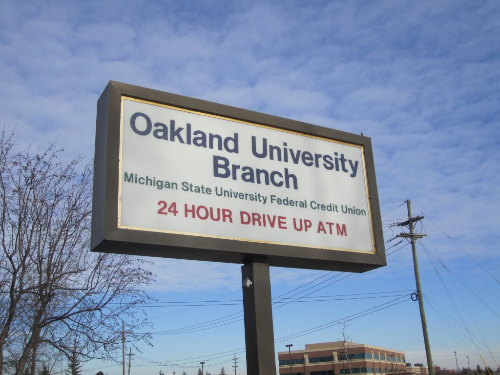 Photograph of an old sign for the Oakland University Branch of MSUFCU, prior to OU Credit Union's tradename development.